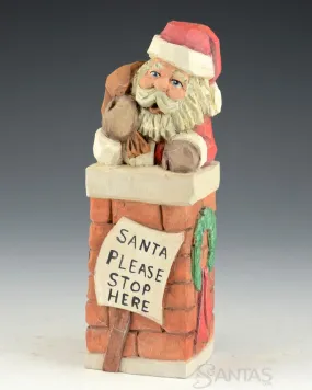 Carved Santa in the Chimney by Russell Scott